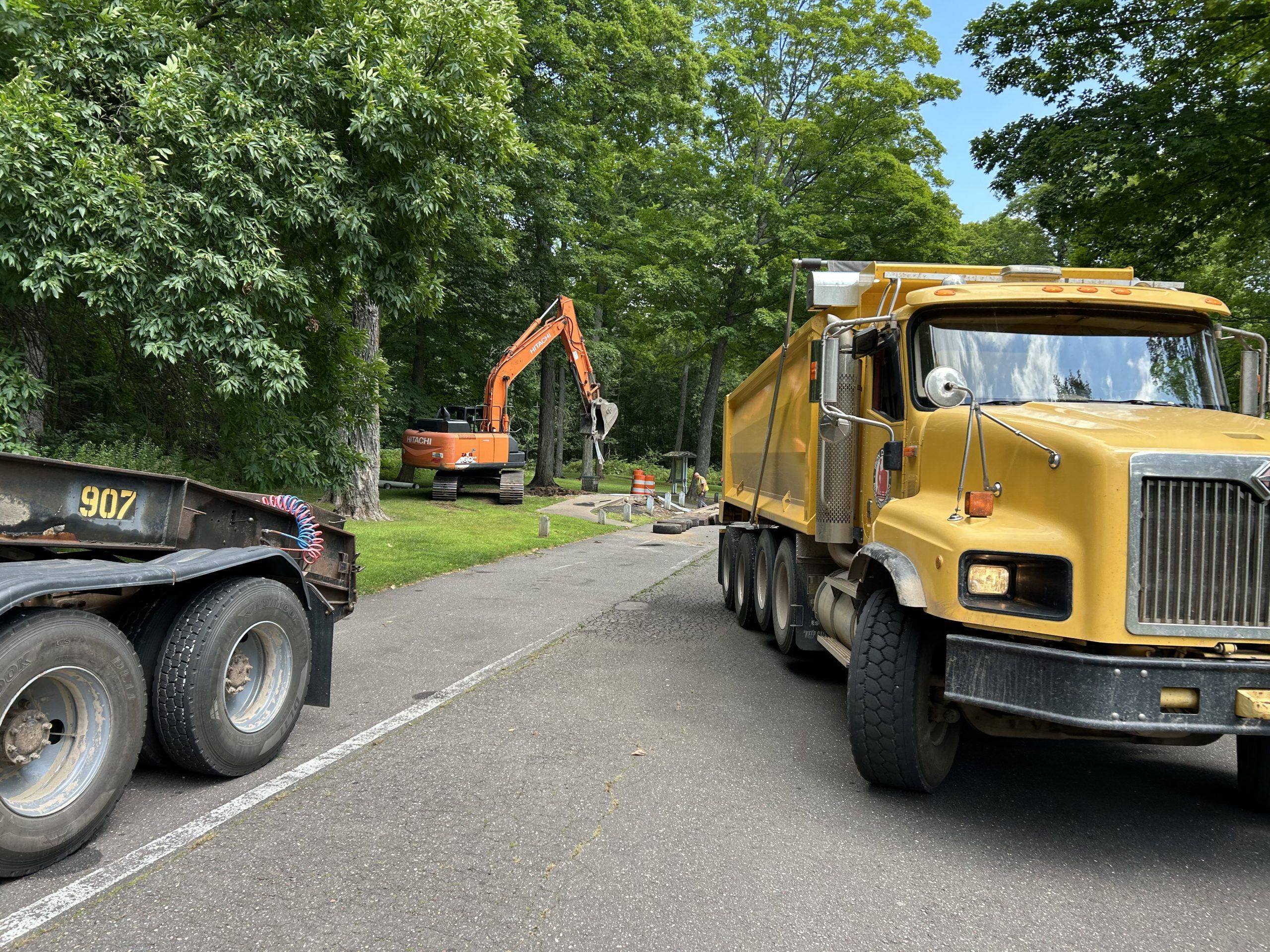 Excavator digging in a construction zone.